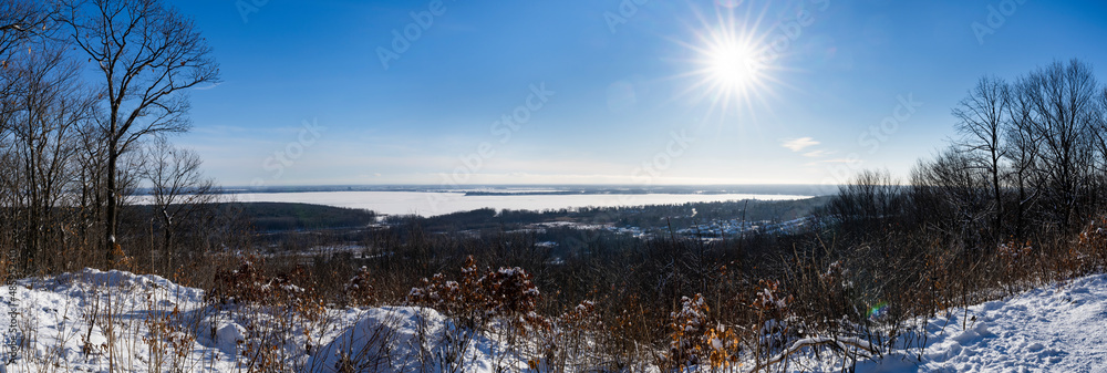 Panoramic view of Lac des Deux Montagnes during a beautiful winter sunny day in Quebec, Canada