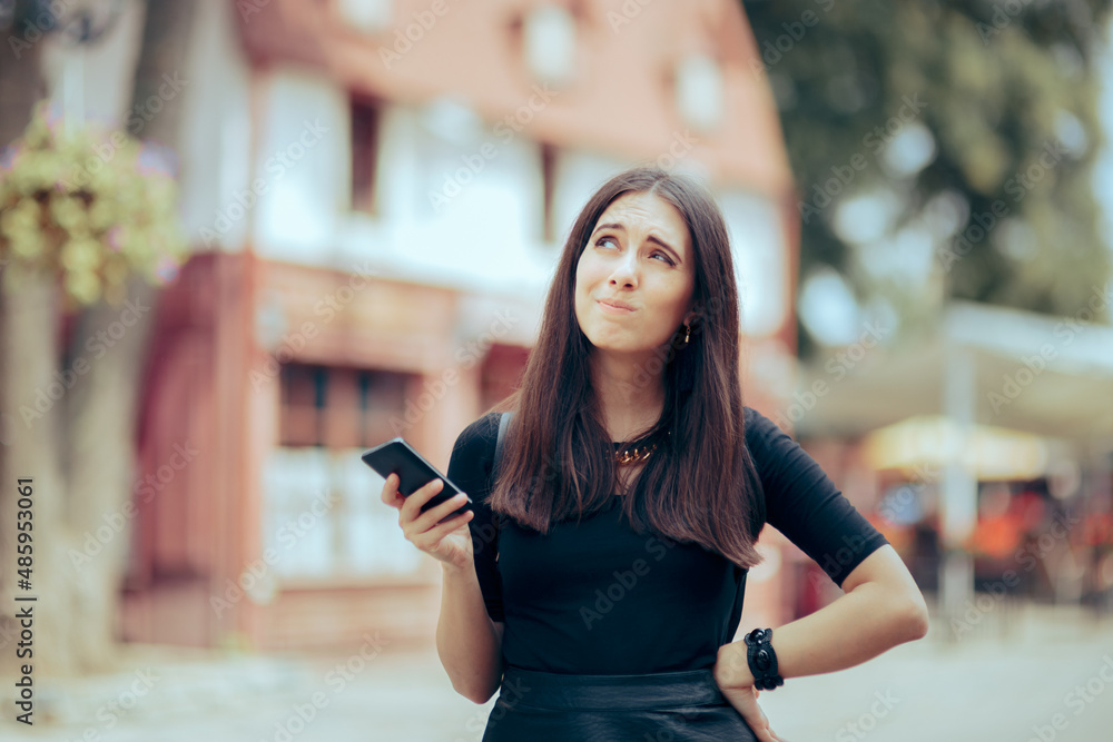 Disoriented Female Tourist Holding Smartphone Looking Puzzled