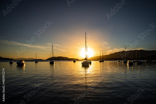 beautiful sunrise on lake nahuel huapi with boats © josho photographer