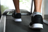 legs of person running on treadmill