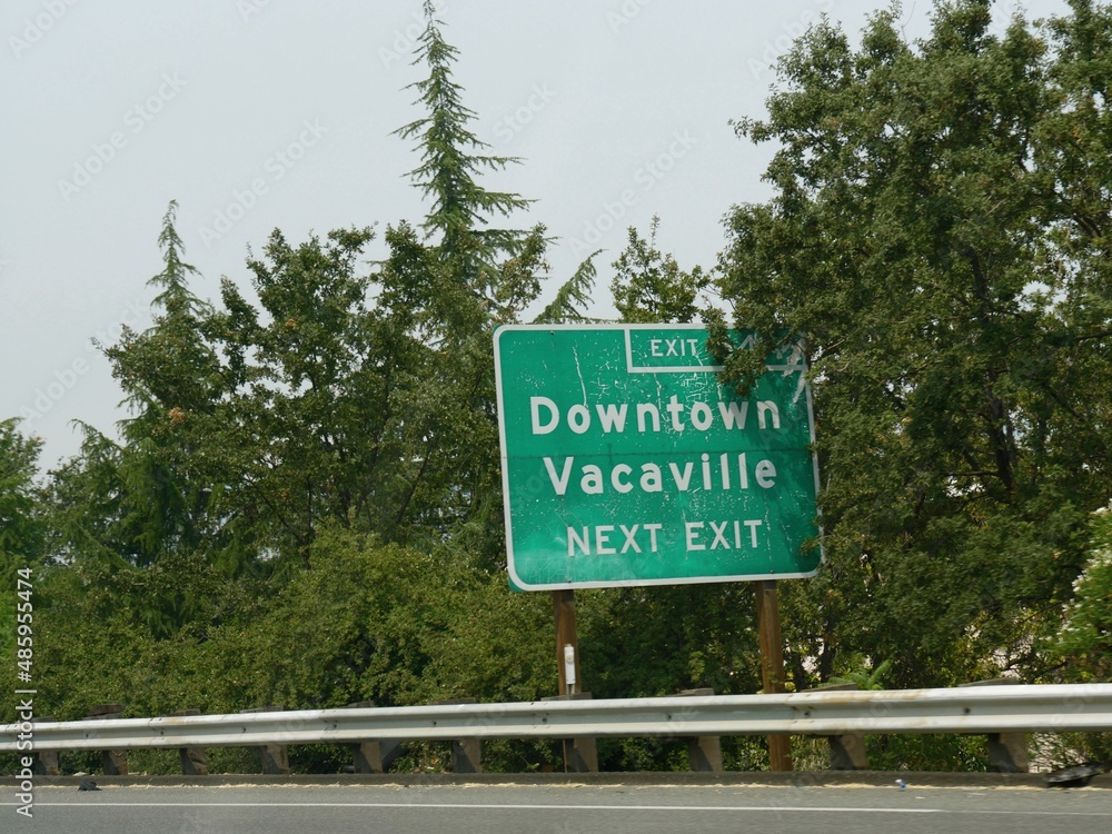 Roadside sign for the exit to Downtown Vacaville at Highway 50, California