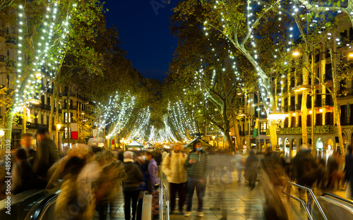 Christmas decorations on the streets in Barcelona in the evening, Catalonia, Spain