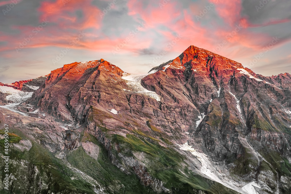 Vibrant Alpine Mountain sunset with fiery summits in Austria