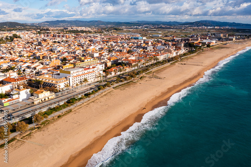 Aerial view of Mediterranean coastal town of Malgrat de Mar with empty beaches, Catalonia, Spain