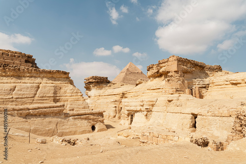 Pyramid of cheops, Pyramid of khufu, at Giza with the Egyptian temple. ancient ruins of the temple in front of the pyramid photo