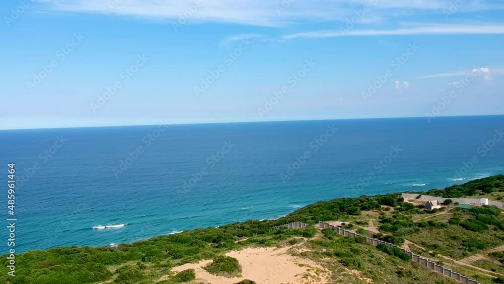 Drone view of blue ocean and green coast Drone view of blue ocean and green coast
