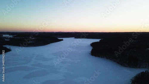 epic aerial winter sunset over the reservoir 