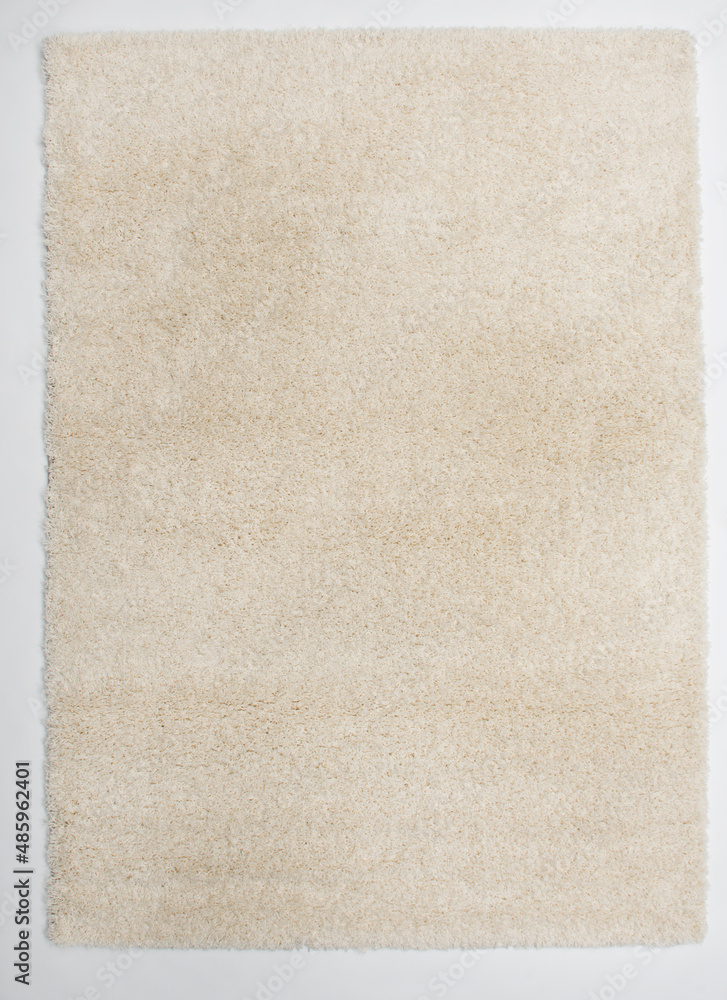 Fototapeta premium The cream-colored almost white carpet is laid on the floor.