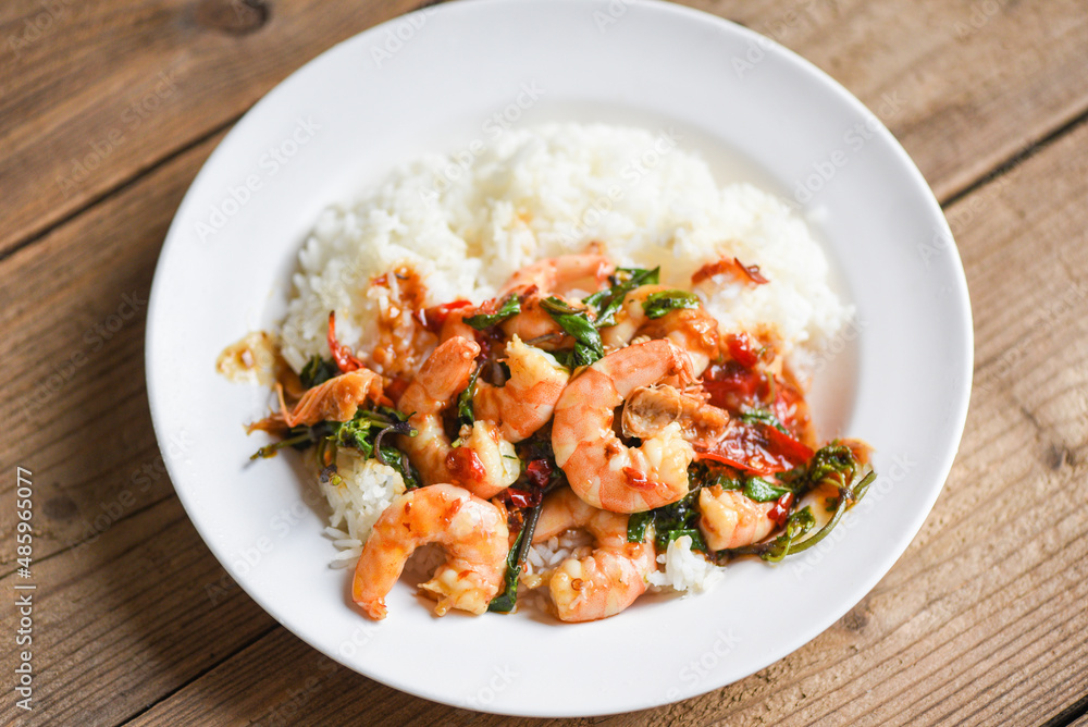 Stir fried shrimp, Cooked rice and fried basil with shrimps prawns,Thai food rice topped shrimp with holy basil leaves Stir fried shrimp, Cooked rice and fried basil with shrimps prawns,Thai food rice topped shrimp with holy basil leaves