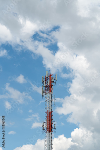Antenna repeater tower on blue sky.