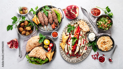 Lebanese food assortment on light background.