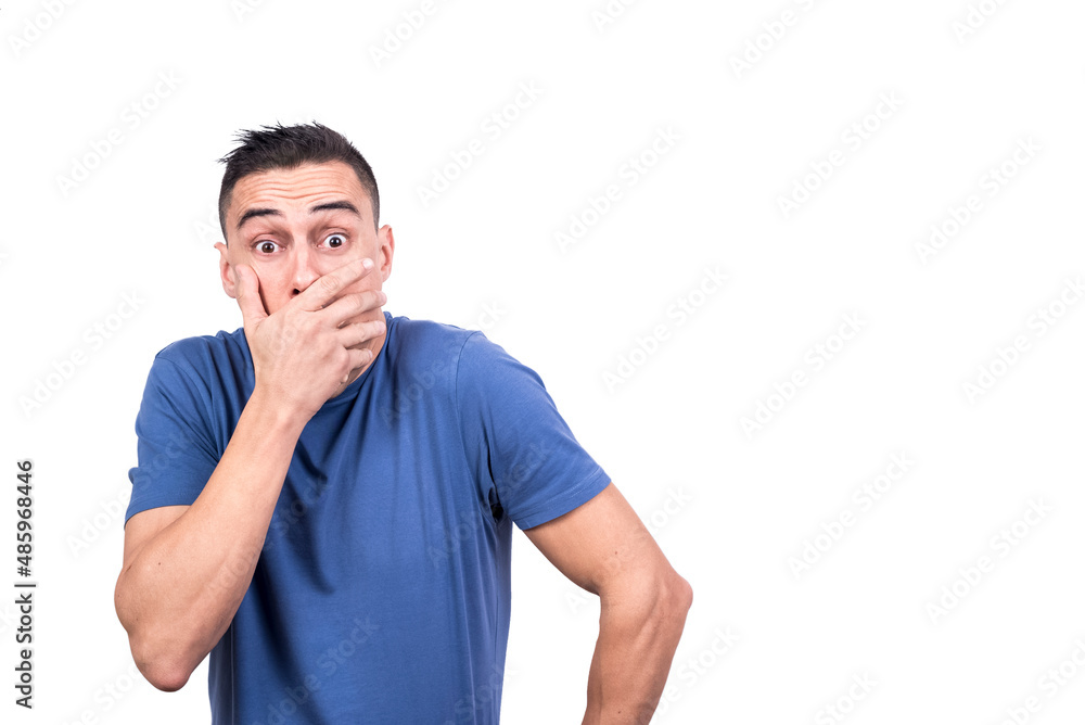 Man covering his mouth with a surprised expression Man covering his mouth with a surprised expression