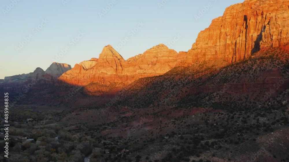 Orange sunlight falling on vertical rocky canyons of Springdale, Zion national park Orange sunlight falling on vertical rocky canyons of Springdale, Zion national park