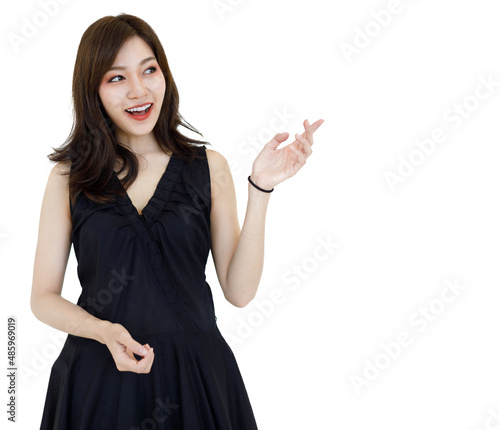 Portrait isolated cutout studio shot Asian pretty friendly young long hair female model wears makeup in casual black dress standing posing smiling look at camera with copy space on white background
