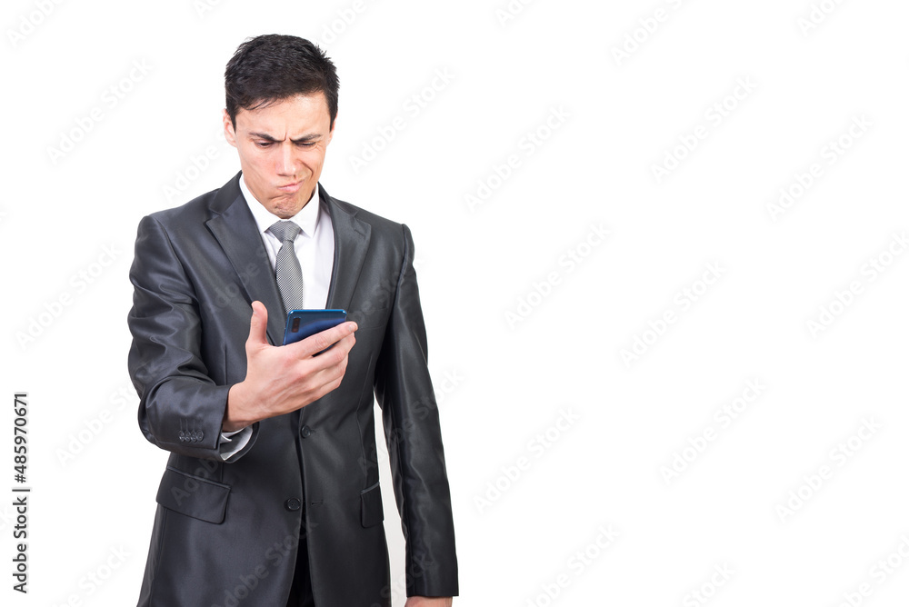 Serious man reading bad news in smartphone and feeling confused Serious man reading bad news in smartphone and feeling confused