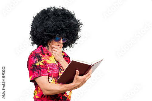 Thoughtful male in Afro wig reading book