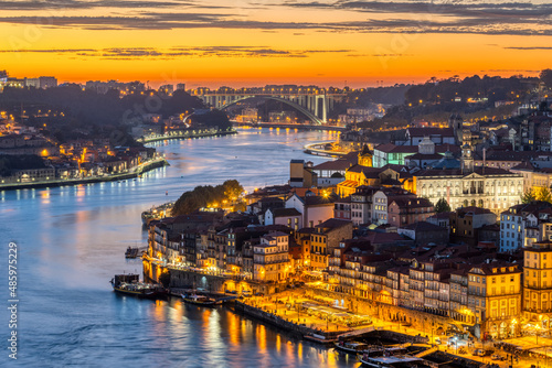 The old town of Porto with the river Douro after sunset