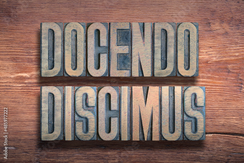 Docendo discimus wood