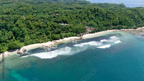 Exotic travel destination tropical Wediombo beach on coast of Java, Indonesia, aerial view photo