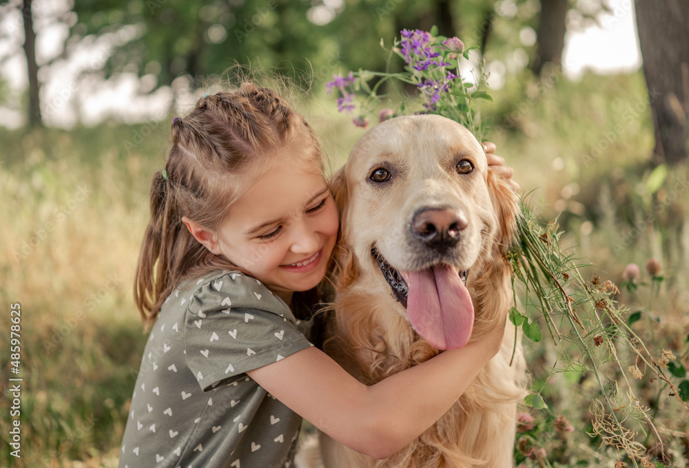 Preteen girl with golden retriever outdoors Preteen girl with golden retriever outdoors