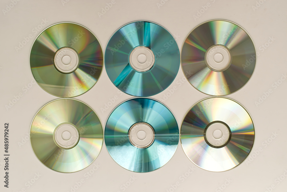 CD and DVD disk on white background. Technology from the 90s CD and DVD disk on white background. Technology from the 90s
