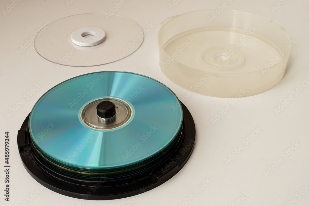 Plastic CD and DVD container on white background. Technology from the 90s. Plastic CD and DVD container on white background. Technology from the 90s.