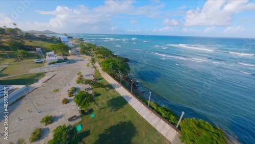 Wallpaper Mural Drone Flying From Parque Juan Lockward Towards La Puntilla Park Along The Edge Of The Atlantic Ocean In Puerto Plata, Dominican Republic. aerial FPV Torontodigital.ca