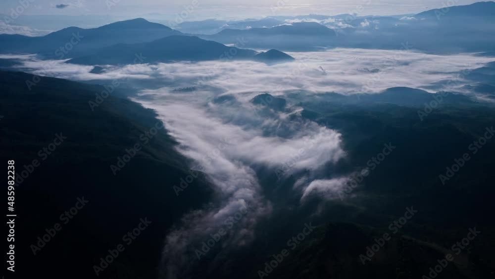 Hyperlapse at sunrise above mountains and fog in Curiti Colombia. Fog moves like a river Hyperlapse at sunrise above mountains and fog in Curiti Colombia. Fog moves like a river