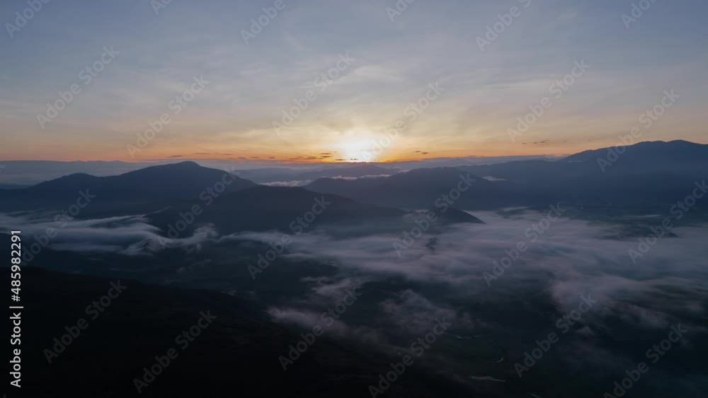 Hyperlapse at sunrise above mountains in Curiti Colombia. Sun appears behind mountains and clouds Hyperlapse at sunrise above mountains in Curiti Colombia. Sun appears behind mountains and clouds