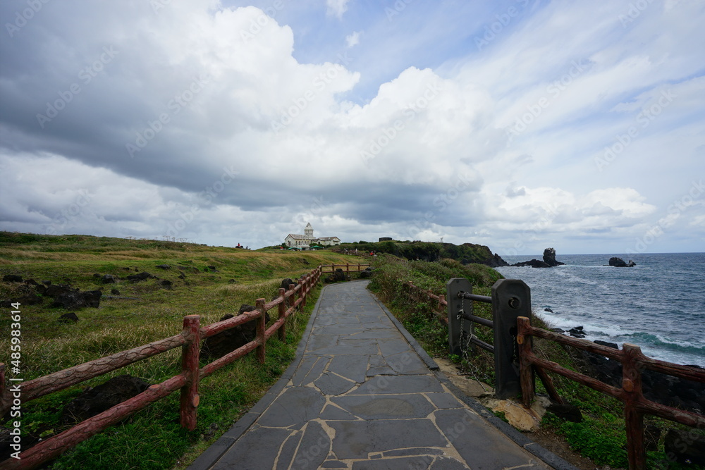 beautiful seaside walkway and thick clouds