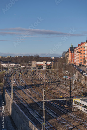 Train to Arlanda airport passing the rail tracks on its way to central station a winter day in Stockholm