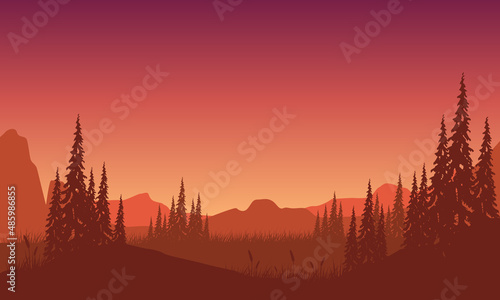 Panoramic silhouette of mountains with a stunning forest at dusk from the edge of the city