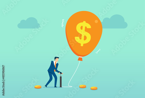 Businessman inflating up a balloon, pumping air unto worn out dollar, inflation of the money bubble, uncontrolled emission of money