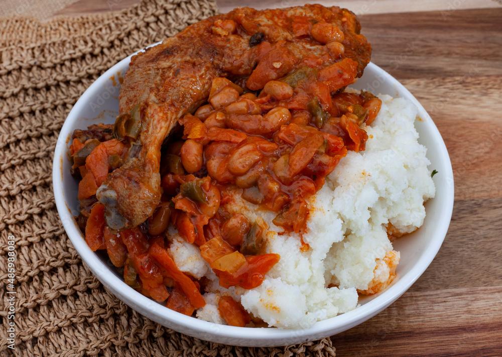 Traditional south African pap and roasted chicken, maize meal with ...