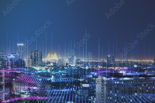 Fototapeta Naklejka Na Ścianę i Meble -  Smart city and big data technology concept background with night megapolis city and illuminated by high-speed lines going up