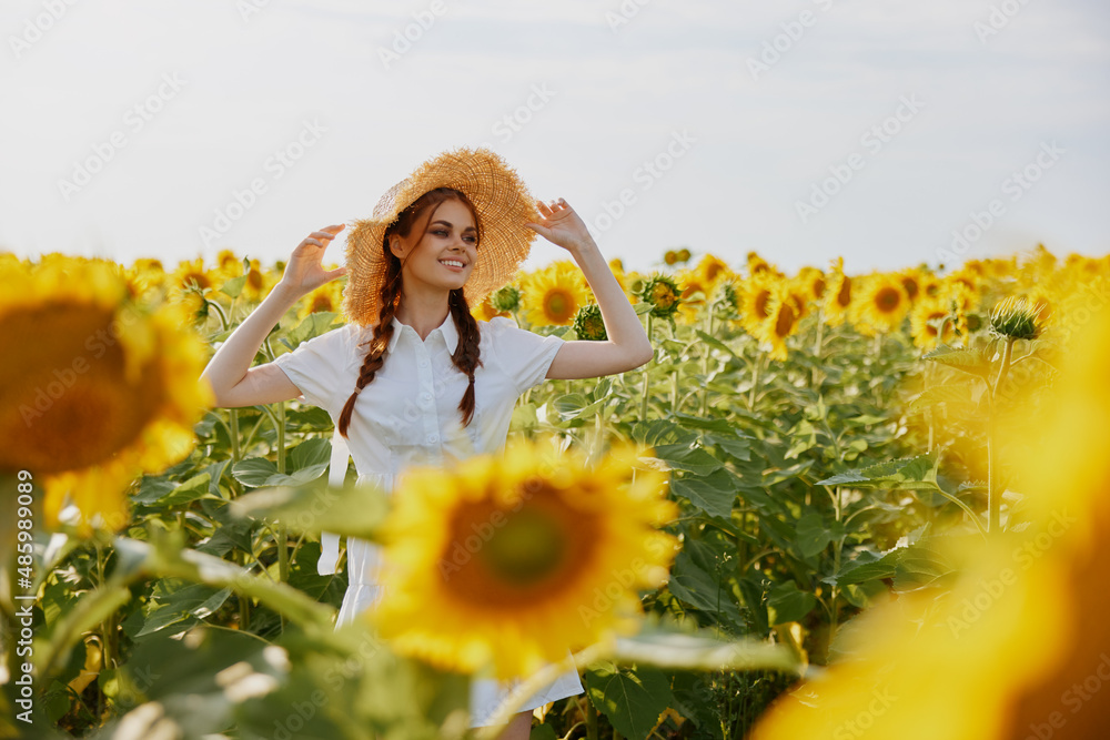 woman portrait In a field with blooming sunflowers unaltered