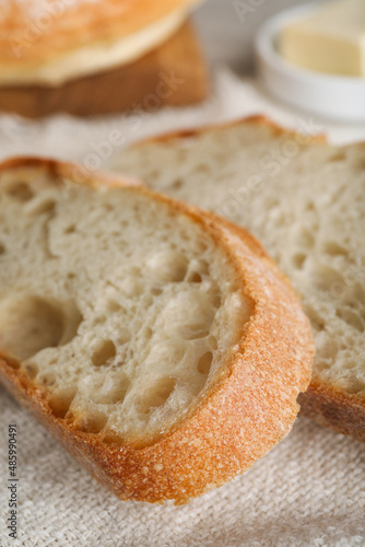 Slices of freshly baked sodawater bread on napkin, closeup photo