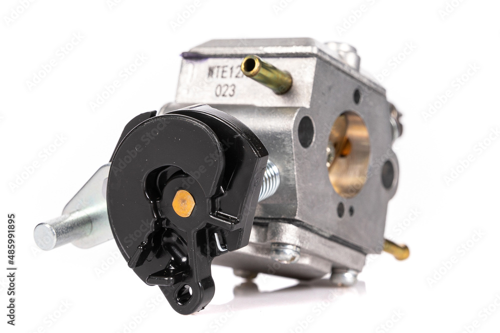 modern carburetor for garden equipment made of aluminum on a white isolated background