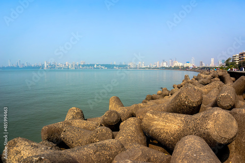 View of the embankment of Mumbai with large stones and sky. photo