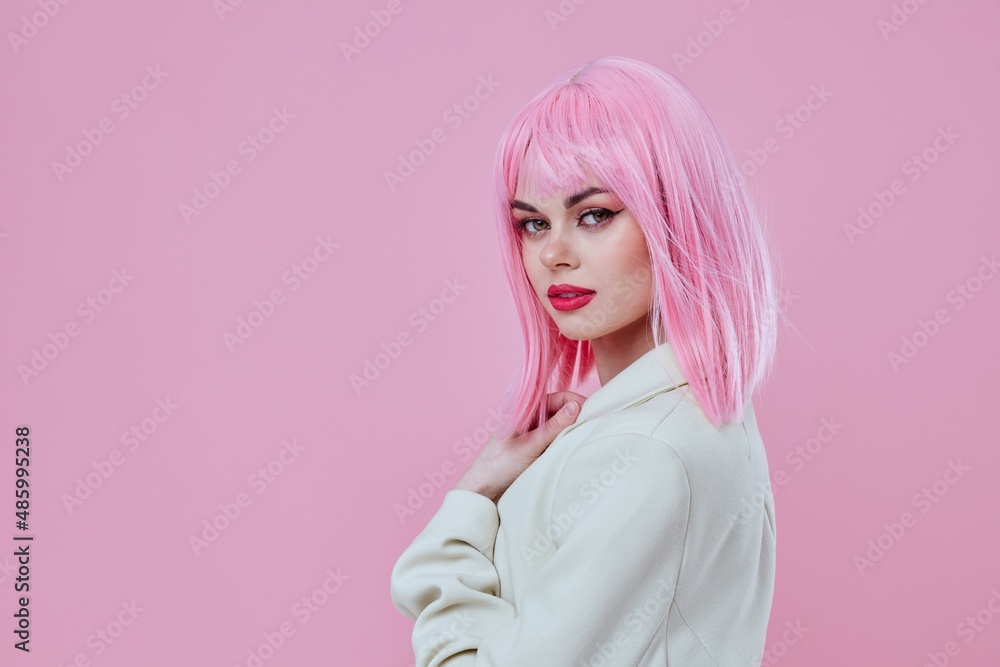 Positive young woman pink hair posing studio model unaltered Positive young woman pink hair posing studio model unaltered