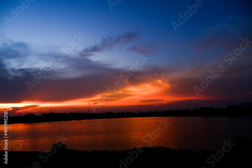 sunset over the lake © Samart