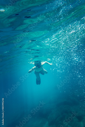 Fototapeta Naklejka Na Ścianę i Meble -  Boy snorkelling undersea
