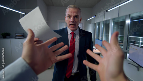 Fotografija POV shot of employee being yelled by angry mature boss in office
