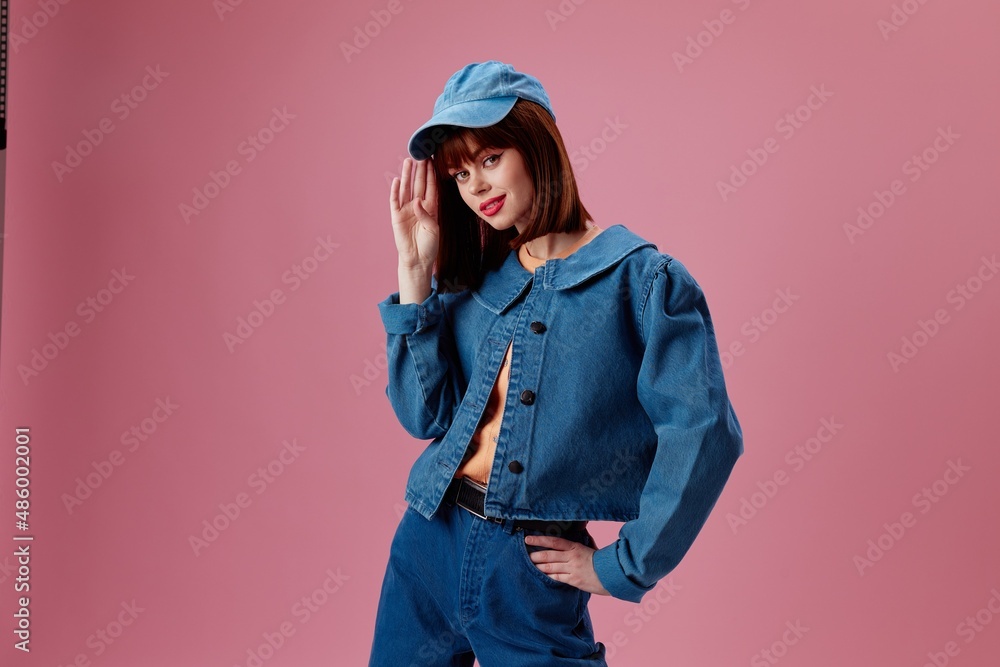Beauty Fashion woman stylish denim clothing posing color background unaltered Beauty Fashion woman stylish denim clothing posing color background unaltered