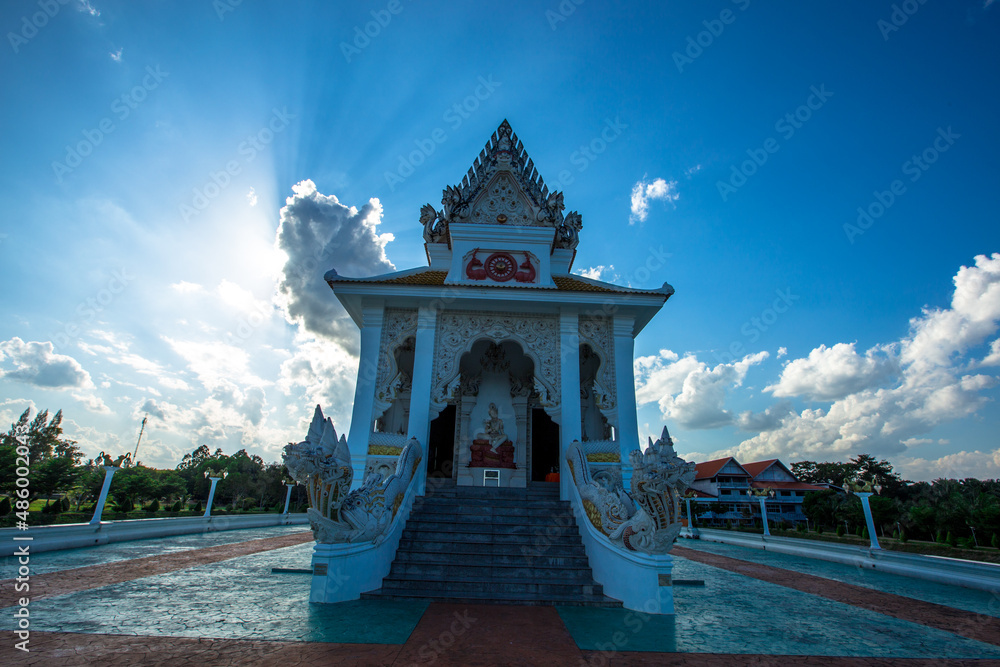 Obraz premium Background of religious sights in Surat Thani province of Thailand, Thung Sied Temple, a wooden church in the middle of the water in white tones built on a white boat-shaped base.