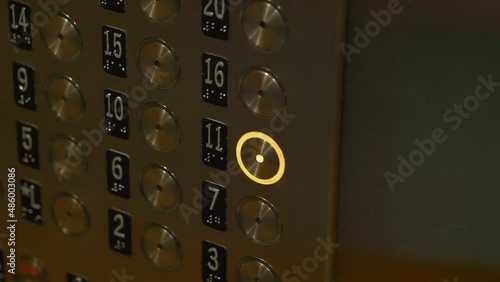 Pressing button in elevator in 4k slow motion 60fps