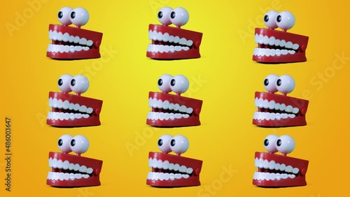Funny Toy Teeth Jaw collage, Contemporary Art. Multiple chattering teeth toy moving on yellow background. photo