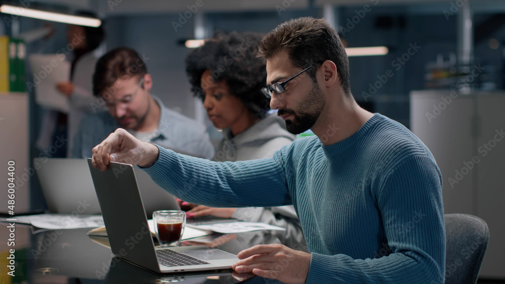 Multiethnic startup team working in modern office. Multiethnic startup team working in modern office.