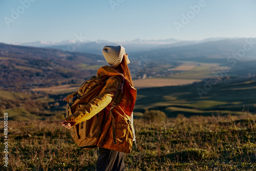 woman traveler admiring the landscape mountains nature Fresh air