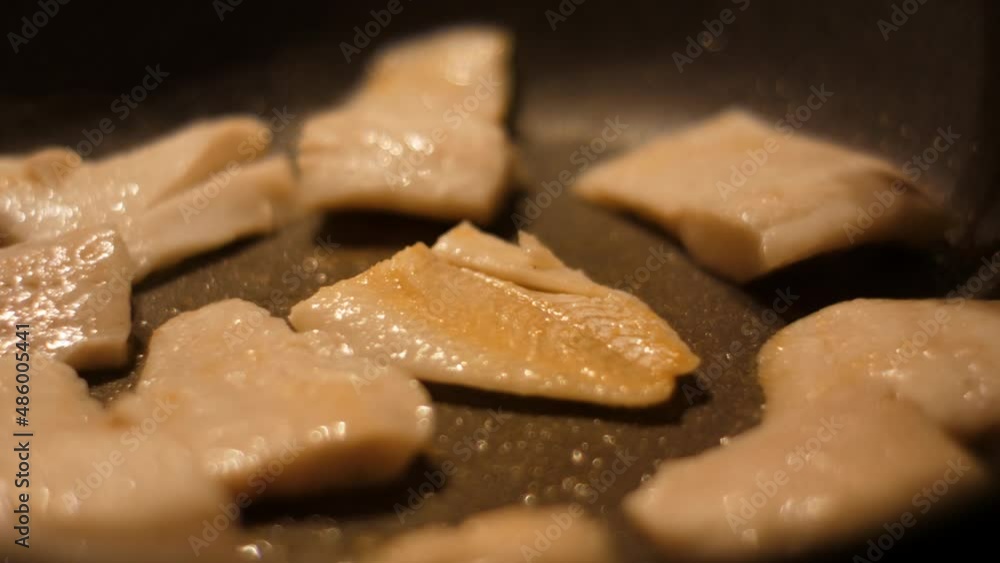 Chef Flips Food Fish. Close up Frying Fillet Hake Fish of Frying Pan With Oil. Roast Healthy Food. Fried Cod Fish Pieces Fillet With Spice Closeup. Healthy Diet Food Omega 3. Low-calorie white meat. Chef Flips Food Fish. Close up Frying Fillet Hake Fish of Frying Pan With Oil. Roast Healthy Food. Fried Cod Fish Pieces Fillet With Spice Closeup. Healthy Diet Food Omega 3. Low-calorie white meat.